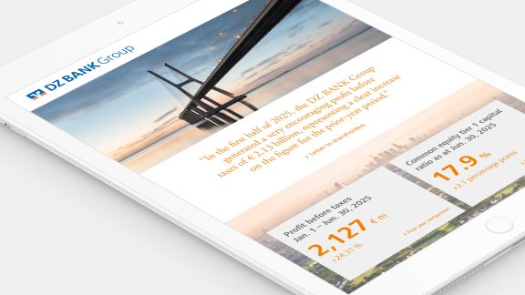 The image appears to display content on a digital tablet screen showcasing information related to DZ BANK Group. The

layout includes:

1. **Visuals**:
   - A scenic photo of a bridge extending across a water body, seen at the top part of the screen.
   - A photo or illustration depicting a city skyline or aerial view, located to the bottom right.

2. **Text**:
   - A quote section referencing the end of 2015, discussing the economic or business status related to DZ BANK Group, likely emphasizing growth, results, or impactful changes.
   - Numerical statistics such as: 
     - "Business Volume" value standing at **2,127 bn** (presumably indicating billion).
     - "Economic Capital" metric at **17.9** reflecting potential financial strength or performance metrics.

3. **Corporate Branding**:
   - The logo or brand of DZ BANK Group is clearly visible, likely positioned close to the top or central part of the screen.
   
**Intended Use**:
- 
The image is probably from an informational presentation, a report, or marketing material highlighting key performance indicators, achievements, or outlining strategic elements associated with DZ BANK Group.

**Note**: The tablet's slight angular orientation adds appeal, presenting information in a sleek, modern format. 

It is important to understand that this evaluation may lack detailed specificity due to the abstract nature of the textual render and information visualized here.