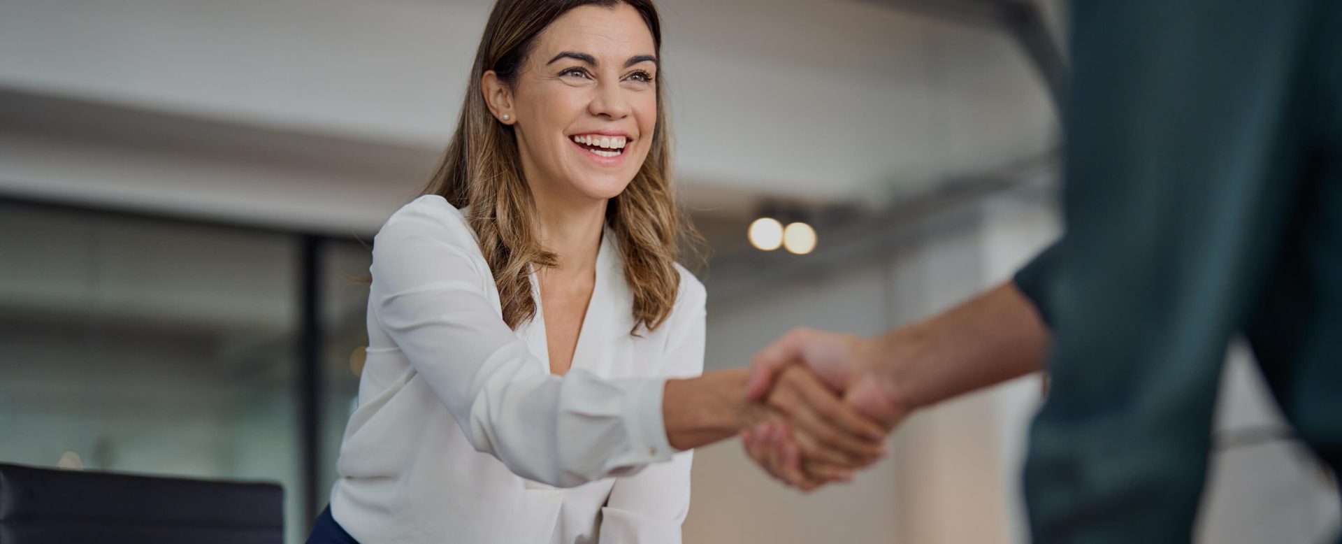 A symbol of trust and reliability: two business people shaking hands