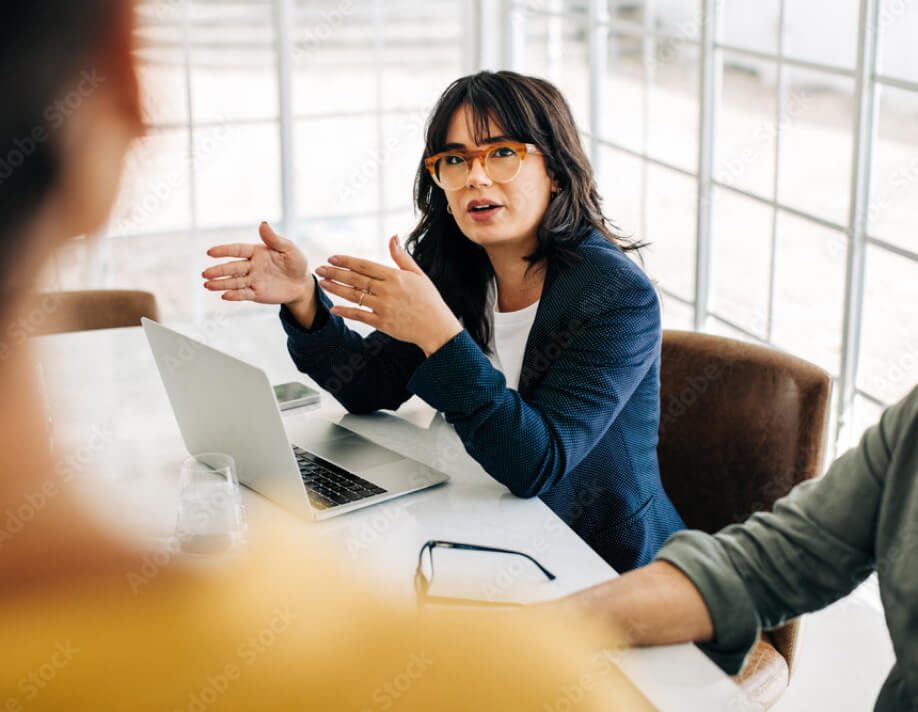 Three colleagues discussing an issue, for example an investor request