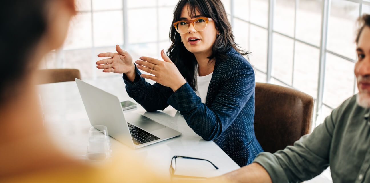 Three colleagues discussing an issue, for example an investor request